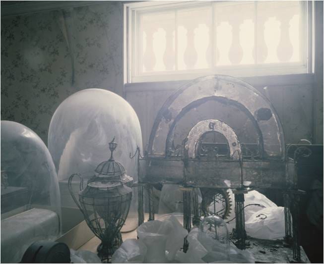 A colour photograph by patrick prendergast of a shabby country house interior.