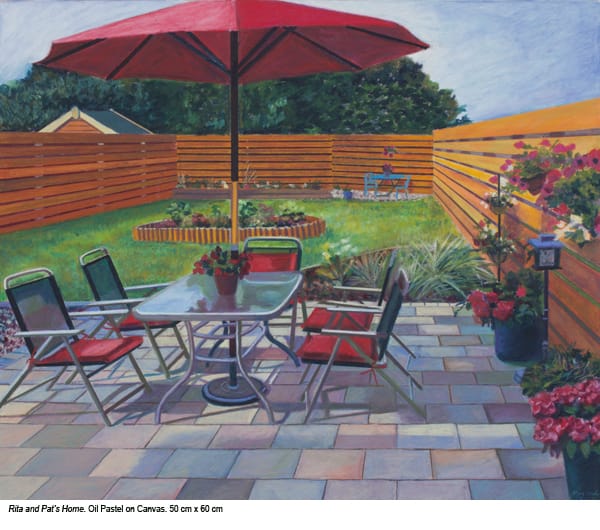 Oil pastel drawing in colour showing garden and patio with flowers in containers, table, chairs and red umbrella, entitled Rita and Pat's Home, by Mary Burke, artist.