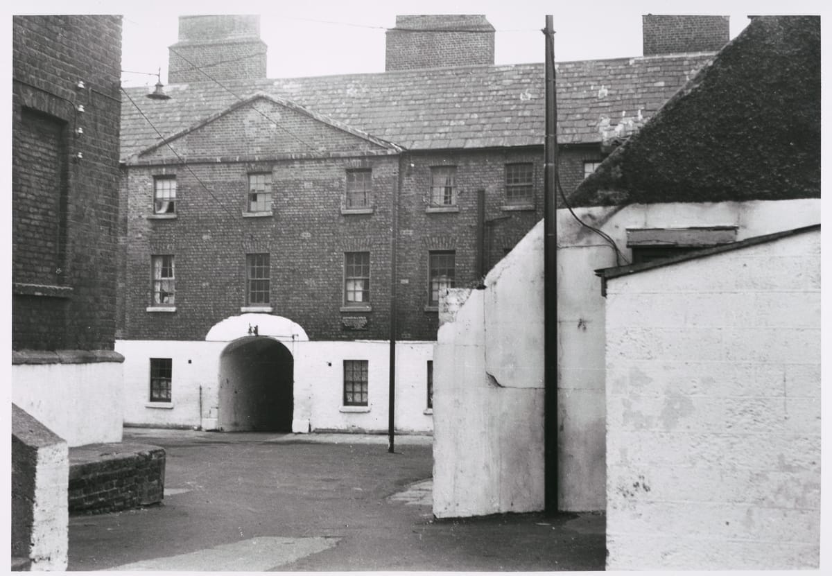 Black and whilte photograph taken by Paddy Healy in about 1960 showing debtors' accomodation, Upper Yard, Marshalea, Dublin.
