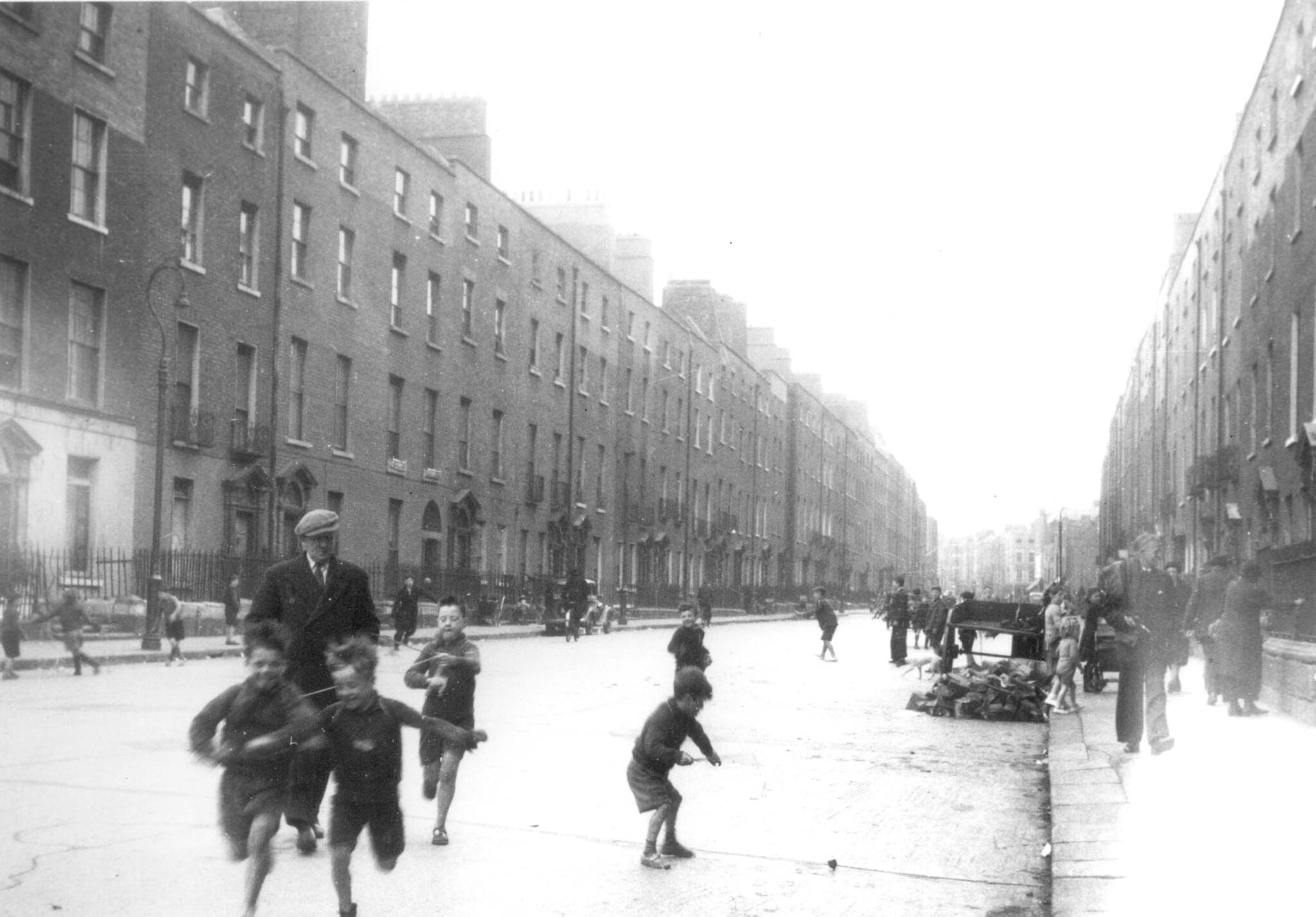 Black and white photograph of children playing on Dominick street, Dublin