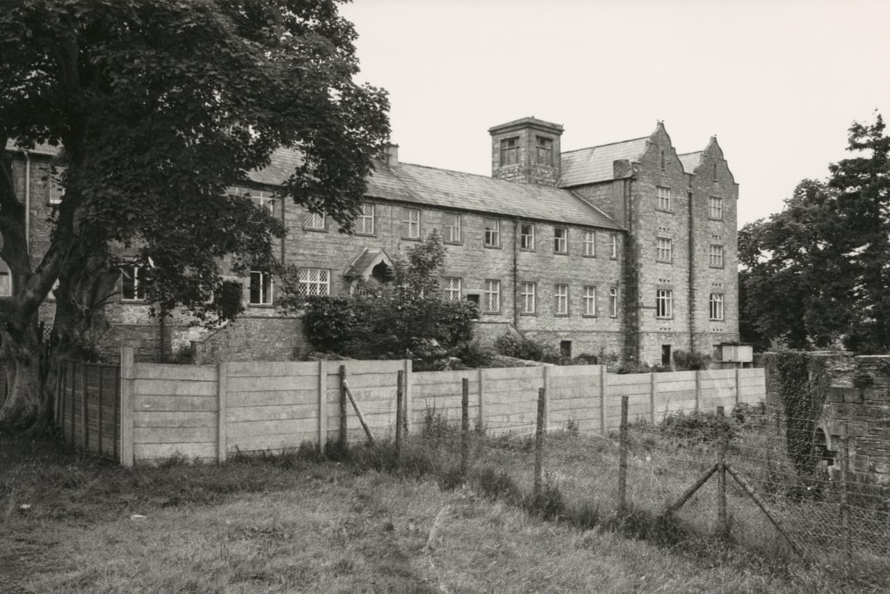 Black and white photograph taken in 1970 of the accommodation building at Lisnaskea Union Workhouse, Co. Fermanagh. THe building was later adapted for commercial and residential use.